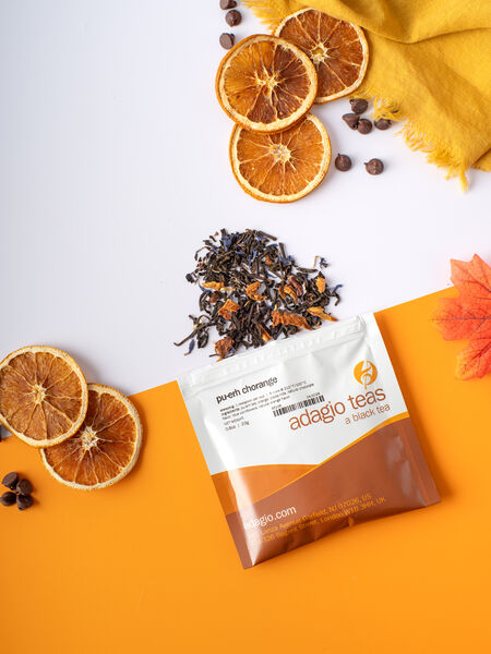 Rich chocolate and sweet orange bring a confectionary note to the gentle earthiness of pu erh. Lively citrus lifts the blend while the warm chocolate and easygoing pu erh are grounding and smooth. Reminiscent of a favorite treat.