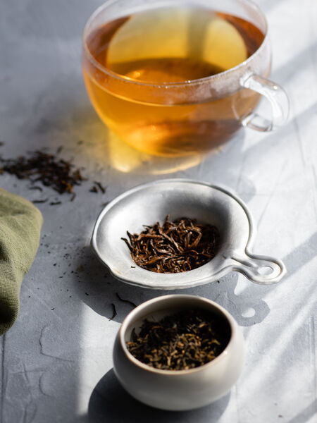 10 Rare and Specialty Teas for Tea Connoisseurs This Jin Jun Mei is a rare black tea from the high mountain village of Tongmu in Fujian, the birthplace of black tea. It is a mix of young golden and very dark leaves. The dry aroma is that of hops, cocoa, and spice.