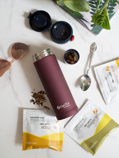 Hot Tea vs. Iced Tea: Summer Choices Enjoy more tea on the go with our 17 oz travel infuser. Its double-walled stainless steel construction will keep your tea quite hot (or cool, if you prefer) for hours. Spring-loaded lid opens easily with just one hand, allowing drivers to keep the other safely on the steering wheel. Sliding easy-click lid-lock prevents accidental openings. Fits most car cup holders.